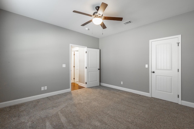 unfurnished bedroom featuring ceiling fan and carpet floors