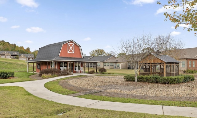 view of home's community with a gazebo and a yard