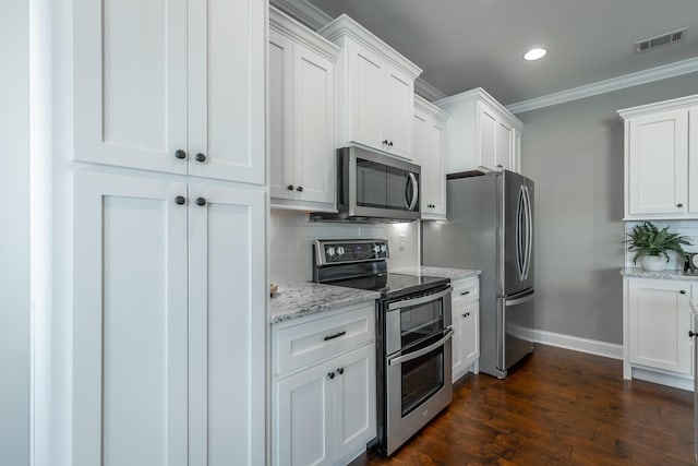 kitchen with stainless steel appliances, tasteful backsplash, light stone countertops, crown molding, and white cabinets