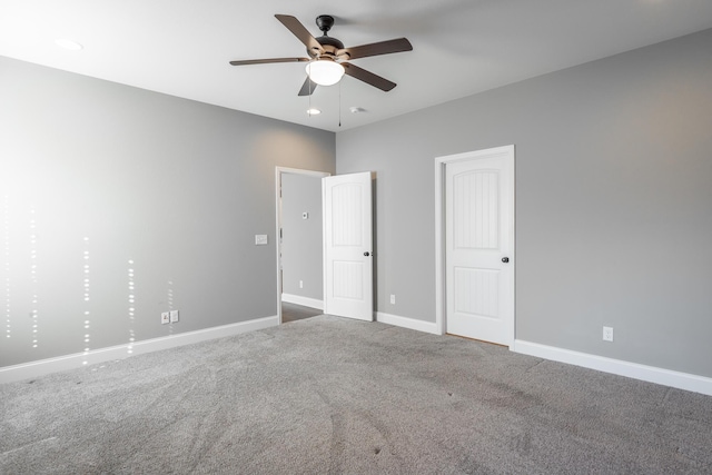 unfurnished bedroom with ceiling fan and carpet flooring