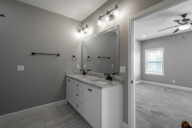 bathroom featuring ceiling fan and vanity