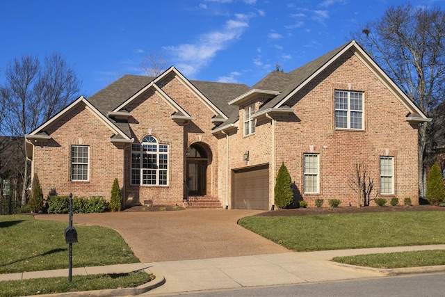 view of front facade featuring a front lawn and a garage