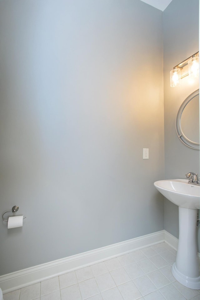 bathroom featuring sink and tile patterned flooring