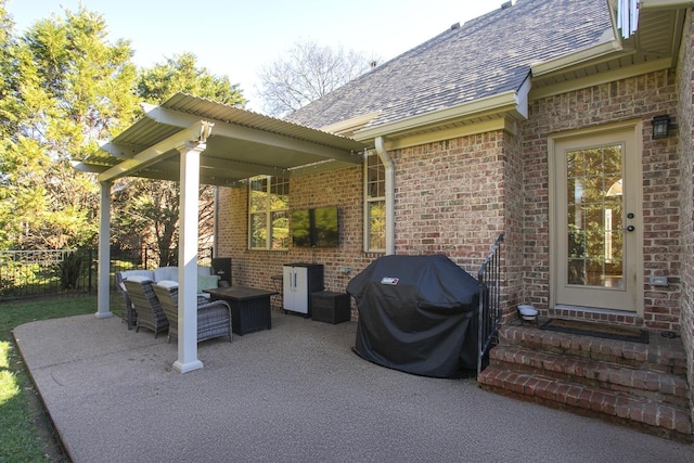 view of patio with an outdoor hangout area and a grill