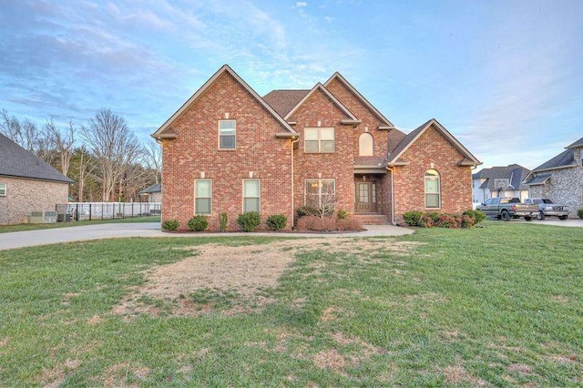 front facade with a front yard