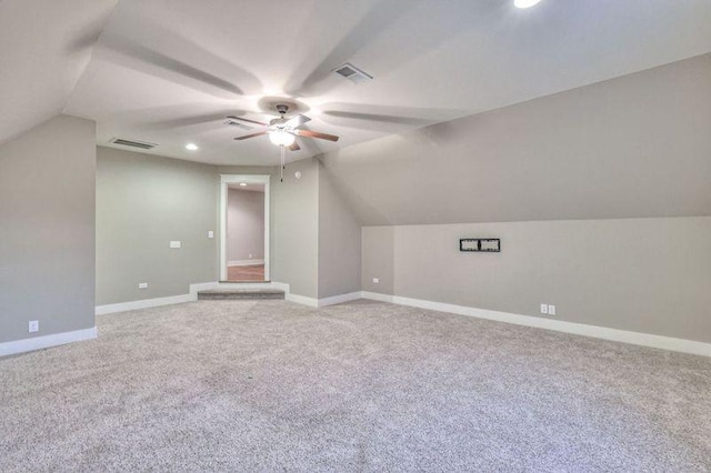 additional living space with ceiling fan, carpet flooring, and lofted ceiling