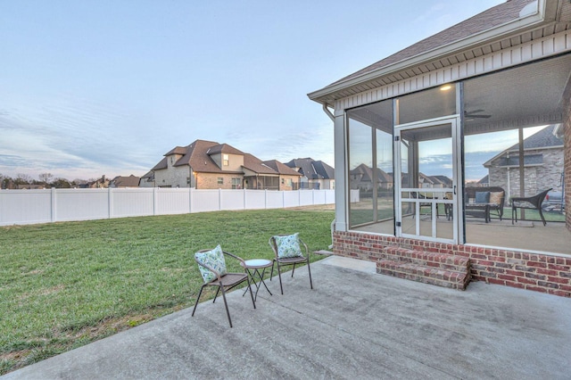 view of patio / terrace featuring a sunroom