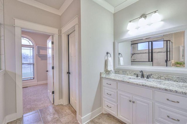 bathroom with vanity and ornamental molding