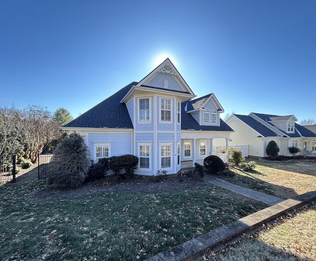 view of front facade with a porch and a front lawn