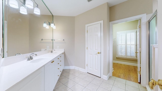 bathroom with tile patterned flooring and vanity