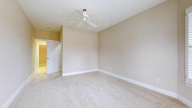 unfurnished bedroom featuring ceiling fan and light carpet