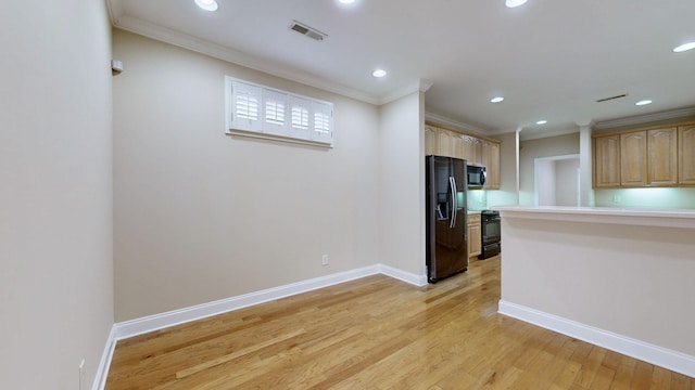 kitchen featuring ornamental molding, light brown cabinetry, light hardwood / wood-style floors, and black appliances