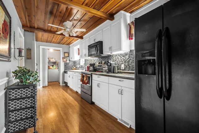 kitchen featuring tasteful backsplash, black appliances, beam ceiling, wood ceiling, and white cabinets