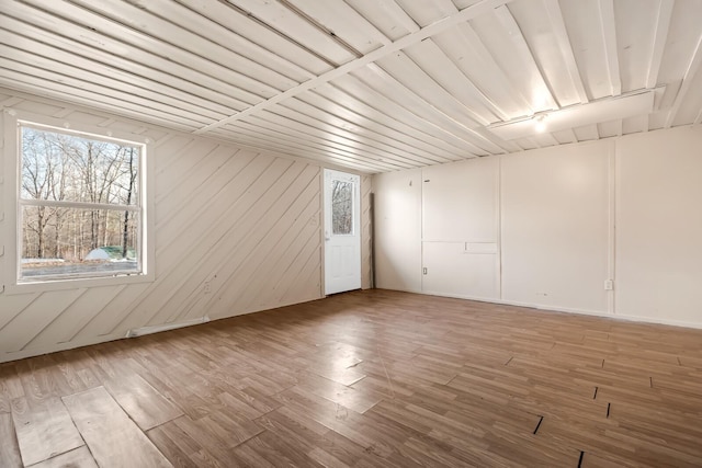 spare room with hardwood / wood-style flooring