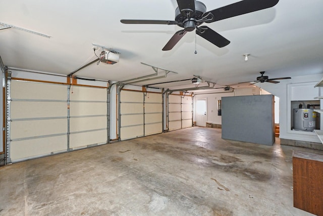 garage featuring a garage door opener and electric water heater