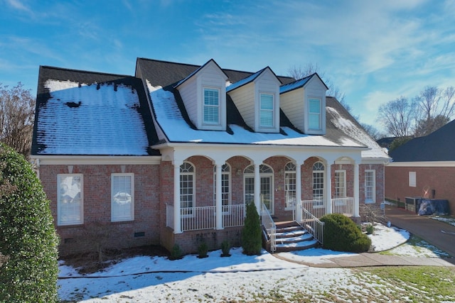 cape cod home featuring a porch