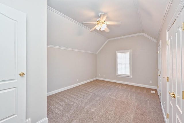 additional living space with vaulted ceiling, ceiling fan, and light carpet