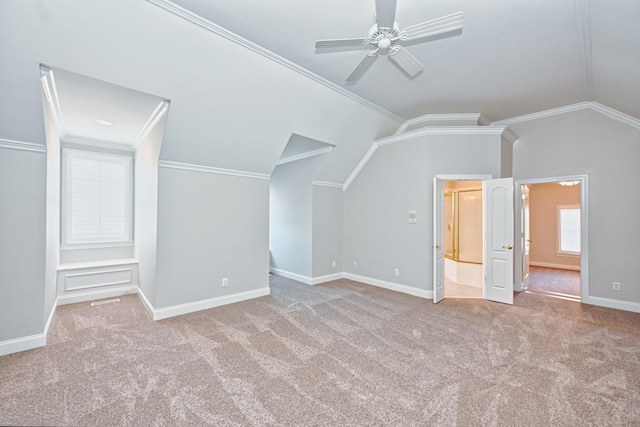 bonus room featuring lofted ceiling, light colored carpet, and built in features