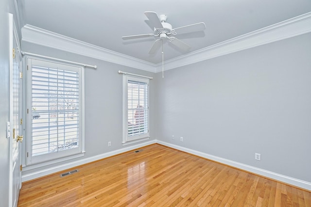 unfurnished room with ceiling fan, ornamental molding, and light hardwood / wood-style flooring