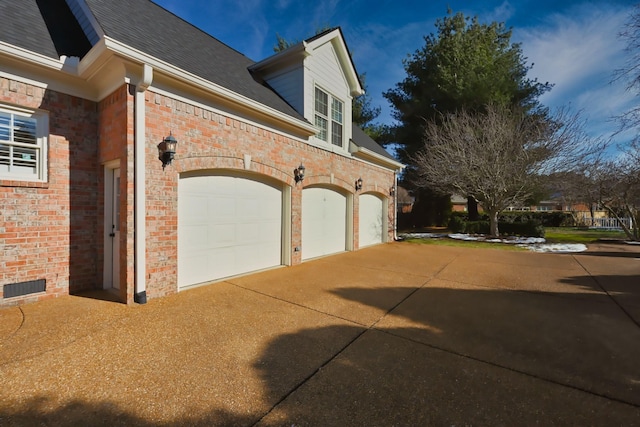 view of side of property featuring a garage