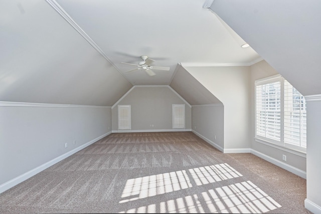 additional living space with vaulted ceiling, ceiling fan, and light colored carpet