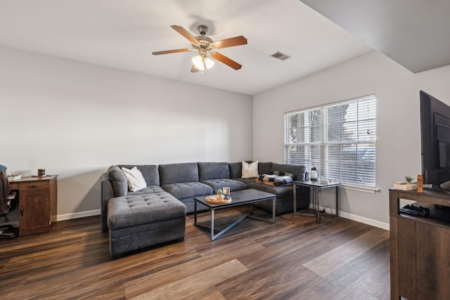 living room with ceiling fan and dark hardwood / wood-style flooring