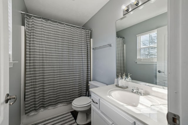 full bathroom featuring a textured ceiling, toilet, vanity, and shower / bathtub combination with curtain