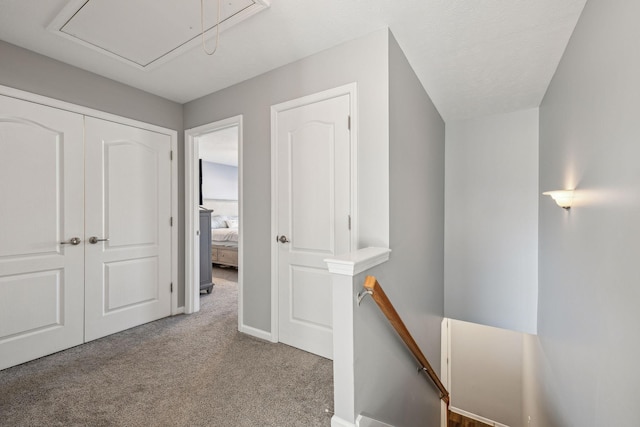 hallway with light carpet