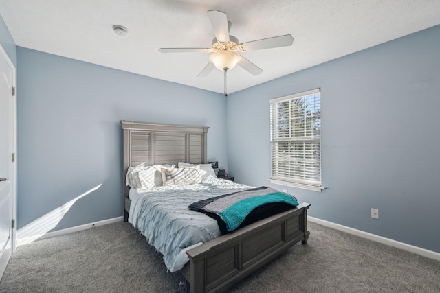 bedroom featuring ceiling fan and dark colored carpet