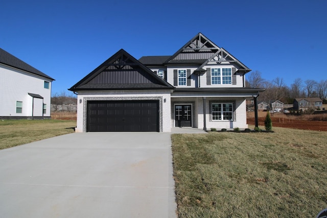 view of front of home with a garage and a front yard