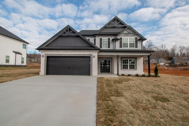 view of front facade featuring a garage and a front lawn