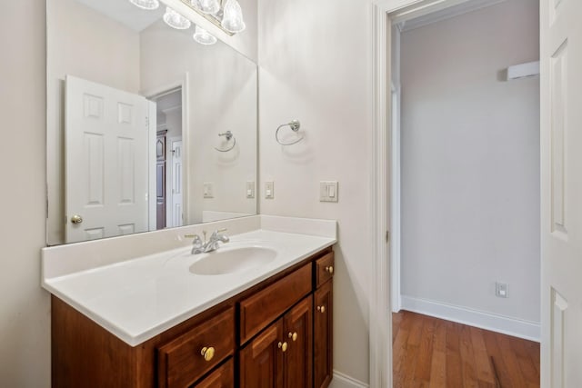 bathroom featuring hardwood / wood-style floors and vanity