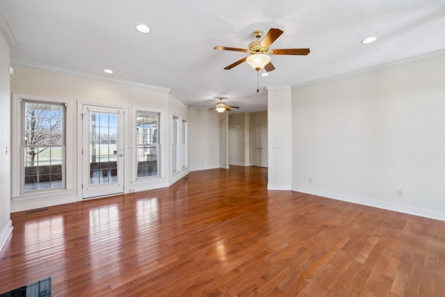 unfurnished living room featuring ceiling fan, wood-type flooring, and ornamental molding