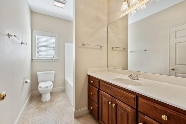 bathroom featuring toilet and vanity