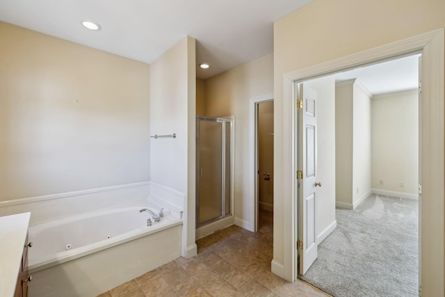 bathroom with vanity and shower with separate bathtub