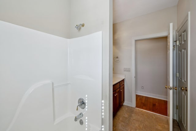 bathroom featuring vanity and shower with separate bathtub