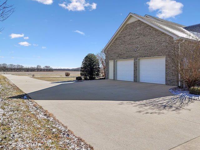 view of property exterior with a rural view