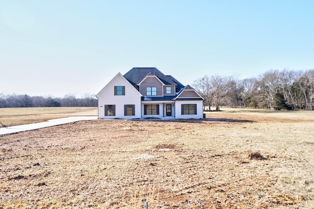 view of front of property featuring a rural view