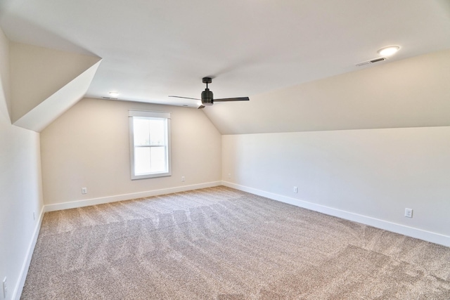 additional living space with carpet, ceiling fan, and lofted ceiling