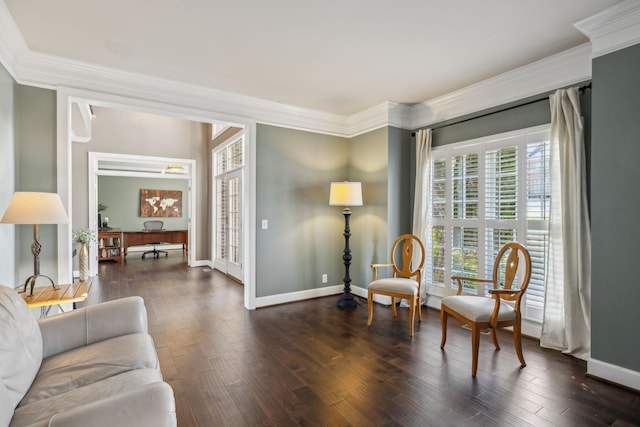 sitting room featuring dark wood-type flooring and ornamental molding