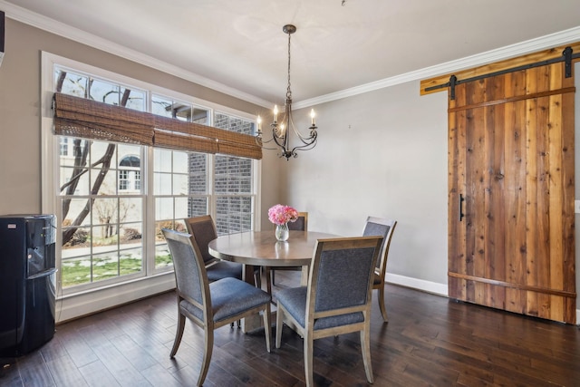 dining room featuring dark hardwood / wood-style flooring, a barn door, and ornamental molding