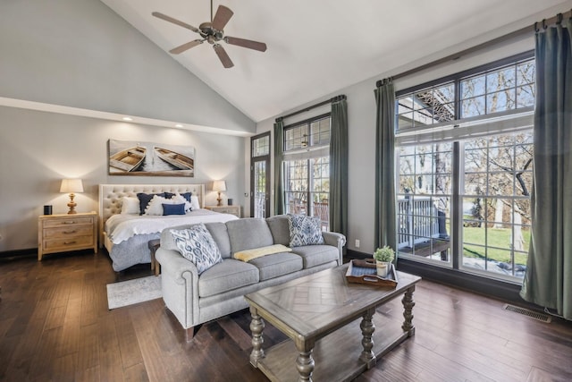 bedroom with ceiling fan, dark hardwood / wood-style flooring, and high vaulted ceiling