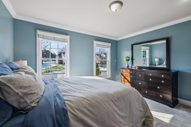 carpeted bedroom featuring crown molding