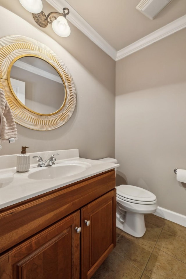 bathroom with toilet, ornamental molding, tile patterned floors, and vanity