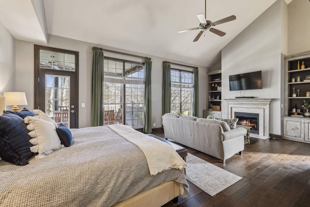 bedroom with ceiling fan, dark wood-type flooring, high vaulted ceiling, and access to outside