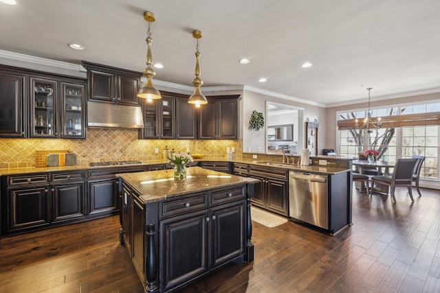 kitchen with a kitchen island, pendant lighting, kitchen peninsula, appliances with stainless steel finishes, and dark brown cabinets