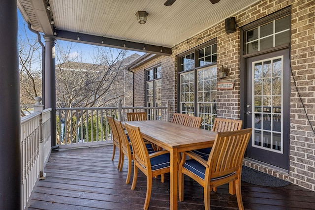 wooden deck featuring ceiling fan