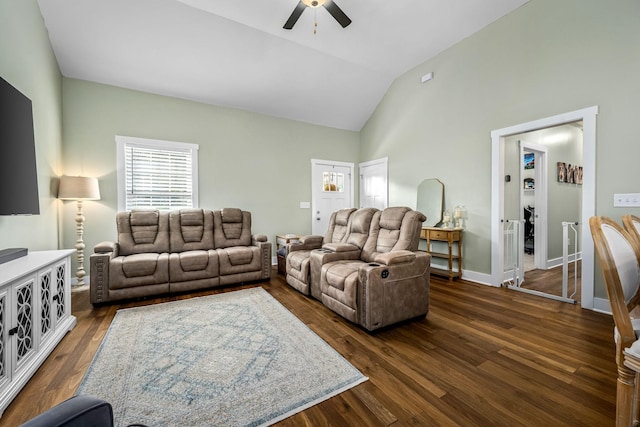 living room featuring lofted ceiling, ceiling fan, and dark hardwood / wood-style flooring