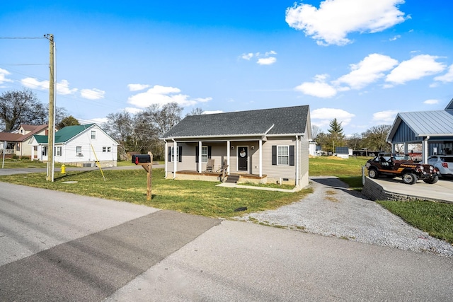 bungalow-style house with a front lawn and a porch