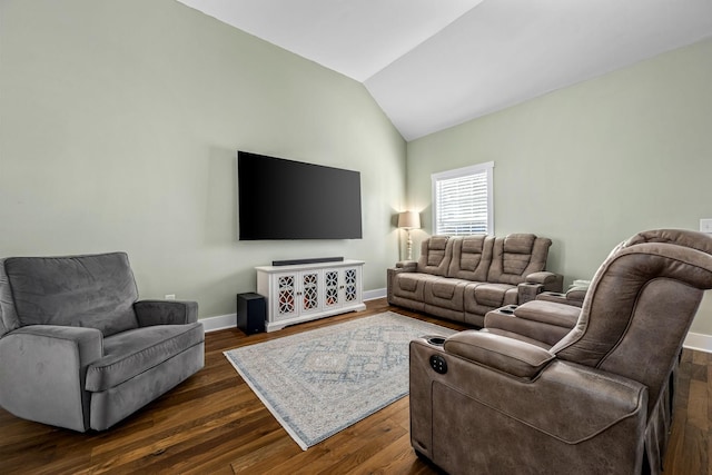 living room with dark hardwood / wood-style flooring and vaulted ceiling